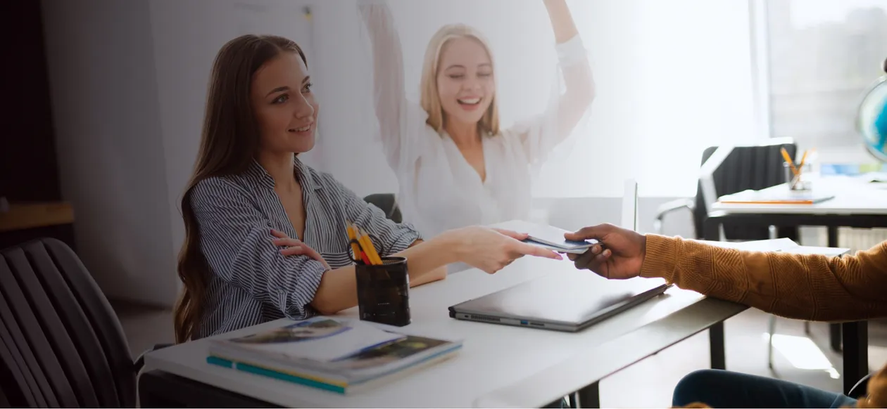 Interview: candidate and employer shaking hands across a table